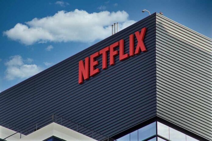 shutterstock_2062987472.jpg Close-up of the Netflix logo on a modern building against a blue sky