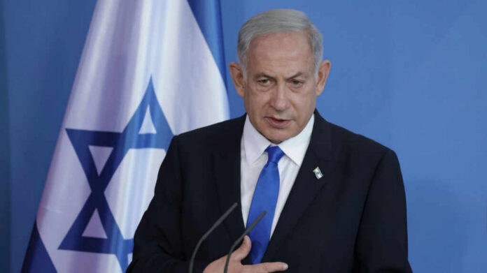Israeli Prime Minister Benjamin Netanyahu_2458279225.jpg Man speaking in front of Israeli flag backdrop