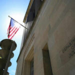 Arctic Frost Scandal: DOJ’s Political Targeting Revealed United States flag Department of Justice building exterior