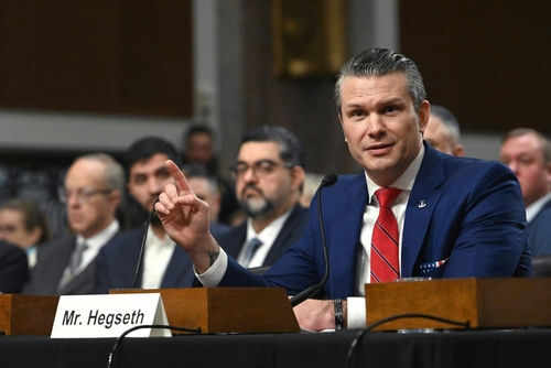 pete-hegseth2571781581jpg Person speaking at a conference meeting with microphone