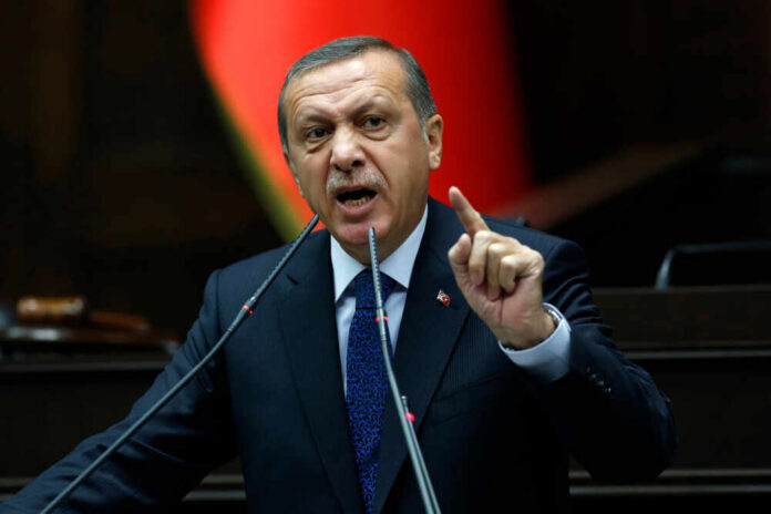 A politician delivering a speech with an emphatic gesture