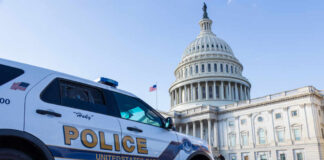 Police vehicle parked in front of the Capitol building