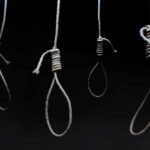 Athlete Executions: Iran’s Brutal Message to Protesters Four nooses hanging against a dark background
