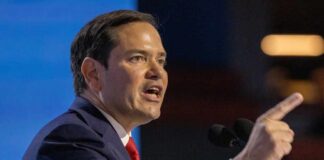 A politician passionately delivering a speech at a podium