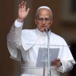 Religious leader delivering a speech outdoors