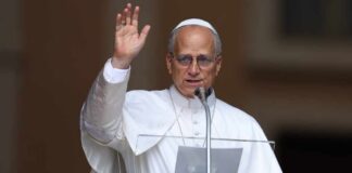 Religious leader delivering a speech outdoors