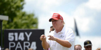 man in white shirt, red hat