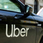 Black car with Uber logo on side door