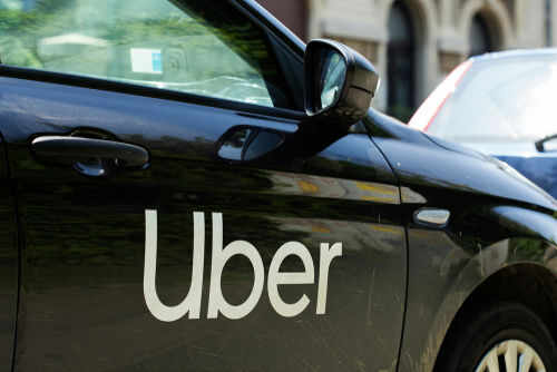 Black car with Uber logo on side door