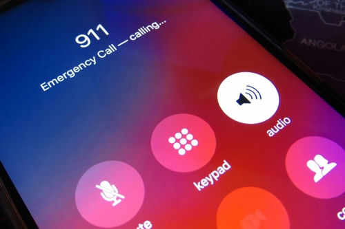 Phone screen displaying 911 emergency call in progress