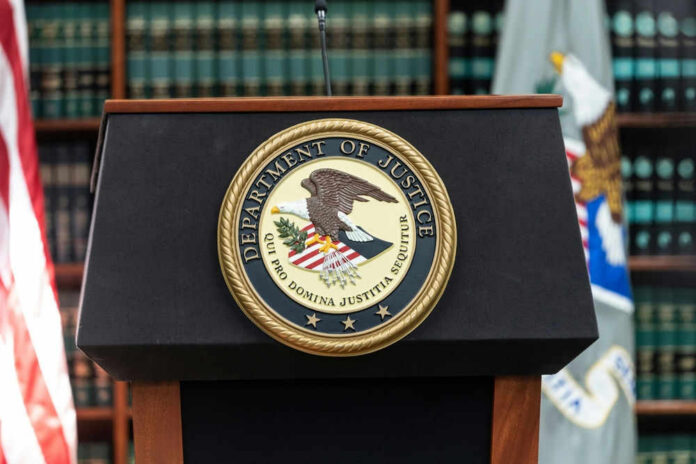 departmentjusticeid2153473169jpg U.S. Department of Justice podium with seal.