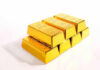 Stack of shiny gold bars on display