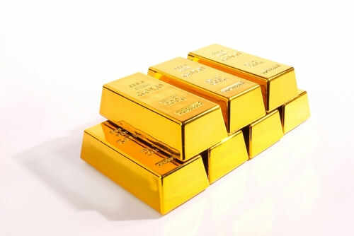 Stack of shiny gold bars on display