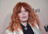 Hollywood Star’s ICE Story DESTROYED by Federal Records Close-up portrait of a woman with red hair at a fashion event