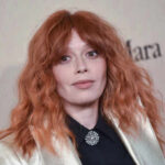 Hollywood Star’s ICE Story DESTROYED by Federal Records Close-up portrait of a woman with red hair at a fashion event