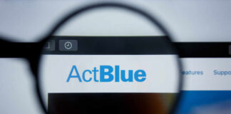 Close-up view of the ActBlue website through a magnifying glass