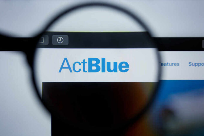 shutterstock_1454624432.jpg Close-up view of the ActBlue website through a magnifying glass