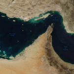 Strait of Hormuz: Hidden Mines, Million-Dollar Fees Satellite view of the Persian Gulf and surrounding geographical features