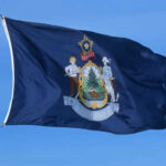 Maine BLOCKS Big Tech Over Power Grid Fears Flag of Maine featuring the state seal and blue background