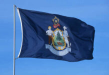 Stunning Legislation: Maine’s Economic Potential CRUSHED Flag of Maine featuring the state seal and blue background