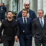 Group of political leaders walking together with security personnel