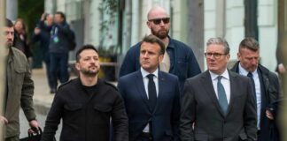 Group of political leaders walking together with security personnel