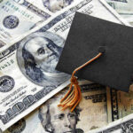 Fear Grows: Student Loan Collections Tighten Under Treasury A graduation cap placed on a pile of U.S. dollar bills