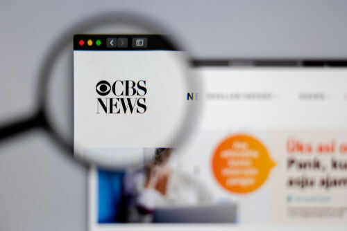 1351207052 CBS News website viewed through a magnifying glass.