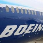 Boeing airplane fuselage with windows and large logo