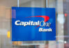 Capital One Bank sign on glass door