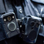 Bodycam BACKFIRE – Police Vindicated? Close-up of a police officer's body camera and communication device