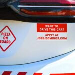 Caught on Camera: Pizza Driver’s Violent Outburst Car with pizza delivery signs and job advertisement