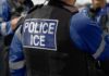 WORLD CUP LOCKDOWN — ICE Role Raises New Questions Close-up of a police officer's vest with 'POLICE ICE' insignia