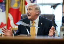Donald Trump speaking animatedly in the Oval Office