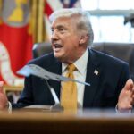 Donald Trump speaking animatedly in the Oval Office