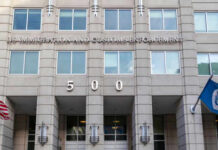 US Immigration and Customs Enforcement building entrance flags