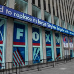 Clay Travis Steps Back as OutKick Is Folded Into Fox News Digital Fox News building exterior with ticker and barricades