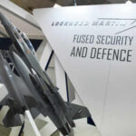 HIMARS FLEX Promises Big—What’s The Catch? Model airplanes on display with Lockheed Martin branding