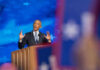 Records Shred Obama’s ‘Same Values’ Claim Man speaking at podium with blue starry background