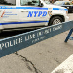 Illegal Fireworks Maim Kids — Brooklyn Chaos NYPD police barricade on city street with vehicles
