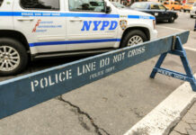 Illegal Fireworks Maim Kids — Brooklyn Chaos NYPD police barricade on city street with vehicles