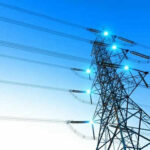 Hidden Regulators, Soaring Bills—Georgia’s Warning Electricity pylon with blue sky background