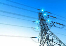 Hidden Regulators, Soaring Bills—Georgia’s Warning Electricity pylon with blue sky background