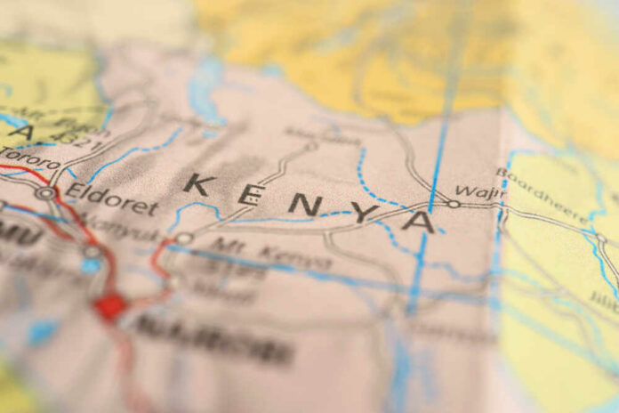 Close,Up,Map,Of,The,African,Countries. Healthcare worker holding a swab and sample tube