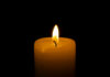 Candle flame glowing in the dark