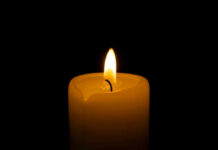 Hogan Death Theories Crumble as Police Close Case Candle flame glowing in the dark