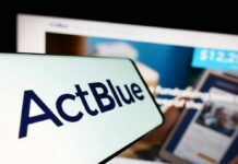 Fifth-Fest Erupts at ActBlue Hearing Close-up of a mobile device displaying the ActBlue logo with a blurred background of a fundraising website
