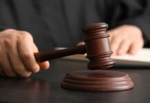 Minnesota Shock — Killer Dodges Execution A judge's hand holding a gavel above a wooden block