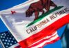 California Republic flag waving alongside the American flag against a blue sky