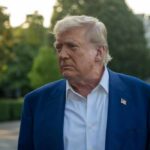 Trump Demands Action—Senate Stalls Again A political figure with a serious expression standing outdoors near the White House